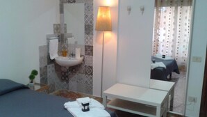 Triple Room, Shared Bathroom | 1 bedroom, Frette Italian sheets, premium bedding, down comforters - Affittacamere Passarelli 9 (Matera)