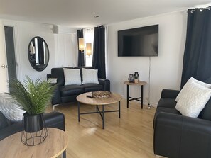 Family House, Multiple Bedrooms, Sea View | Living area | TV - Le Gaspésiana (Sainte-Flavie)