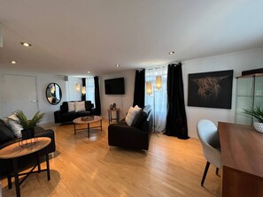 Family House, Multiple Bedrooms, Sea View | Living area | TV - Le Gaspésiana (Sainte-Flavie)