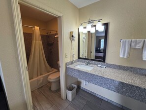 Room, 1 King Bed | Bathroom | Combined shower/tub, hair dryer, towels, soap - Westwoods Motel (Fulton)