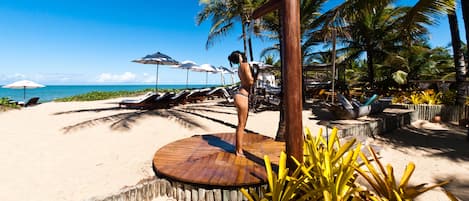 On the beach, sun loungers, beach umbrellas, beach towels