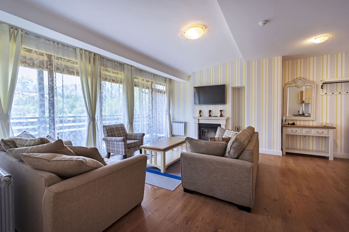 Apartment, 2 Bedrooms | Living area | Flat-screen TV, fireplace