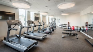 A gym with treadmills, ellipticals, free weights, and exercise balls. - The Hotel At Oberlin (Oberlin)