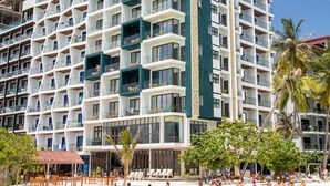 A multi-story hotel with balconies, a beachside location, and a clear view of the ocean. - Arena Beach Hotel (Maafushi)
