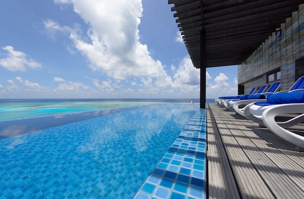 Indoor pool, open 10:00 AM to 8:00 PM, pool loungers