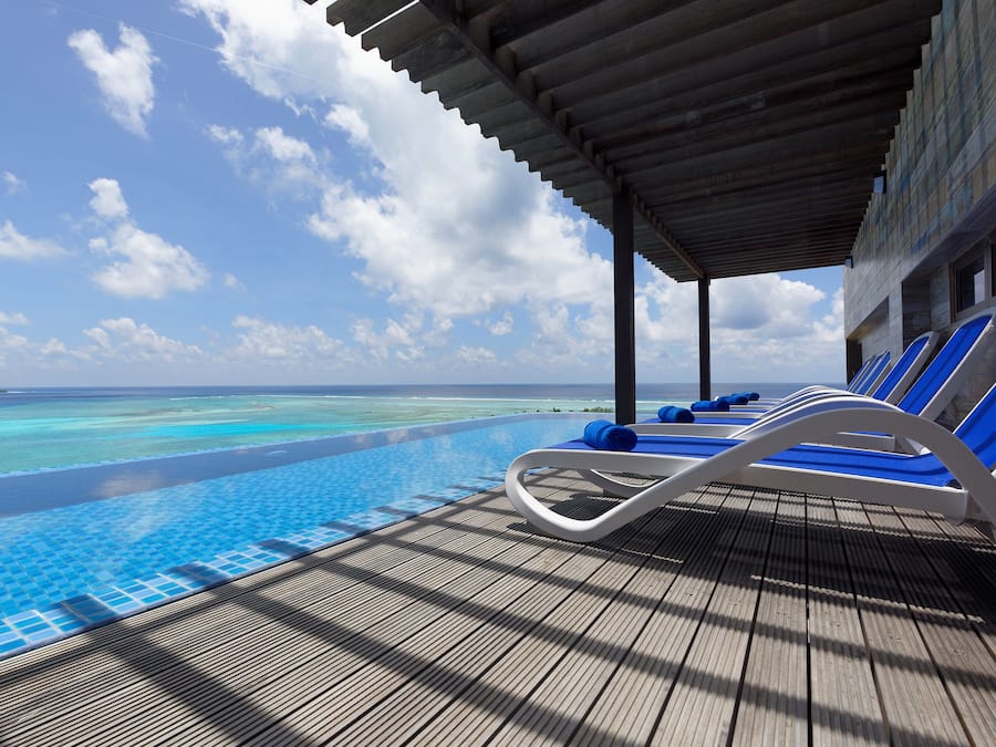 Indoor pool, open 10:00 AM to 8:00 PM, pool loungers