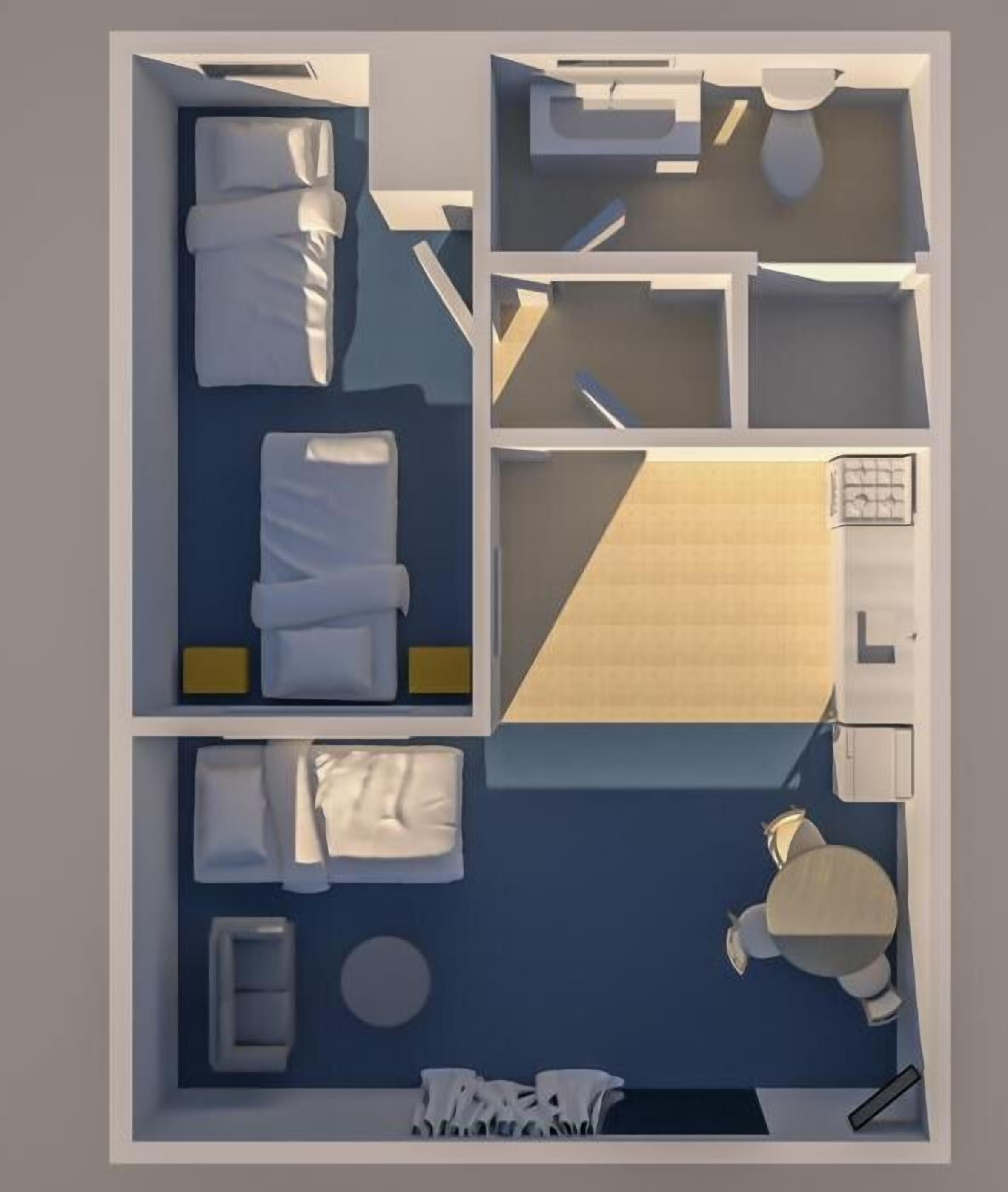 A hotel room layout with a bed, a desk, a chair, a small table, and a bathroom.