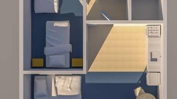 A hotel room layout with a bed, a desk, a chair, a small table, and a bathroom.