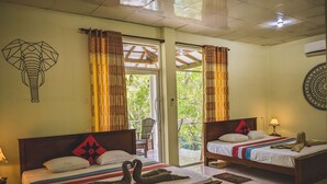 A hotel room with two beds, a wooden headboard, a wall art of an elephant, and a view of greenery through the window. - Sigiri Choona Lodge (Sigiriya)