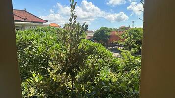 Deluxe Room, 1 Bedroom, Non Smoking, Garden View | Living area | 14-inch LCD TV with premium TV channels, TV