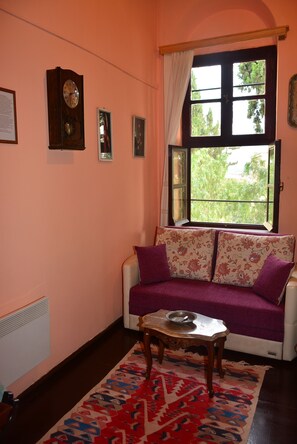 Superior Triple Room, High Ground Floor | Living area | LCD TV