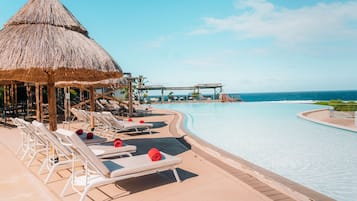 Outdoor pool, pool umbrellas, sun loungers