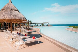 Outdoor pool, pool umbrellas, sun loungers