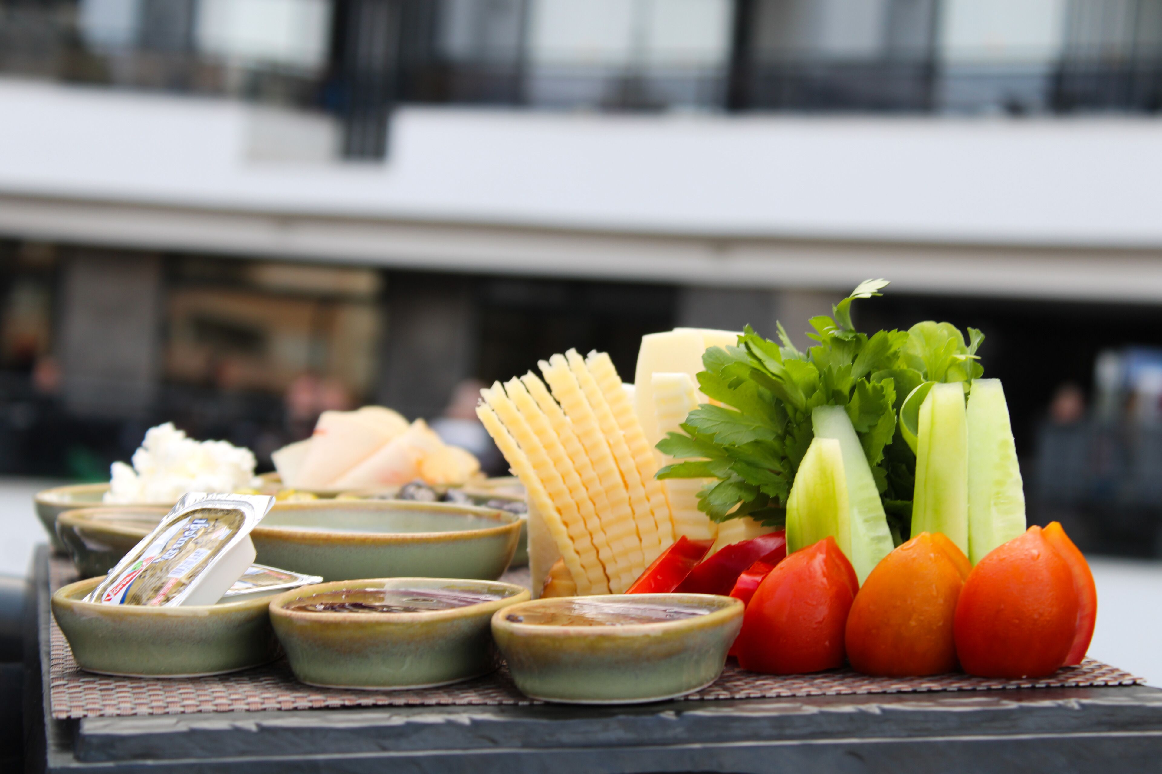 A table with various food items including vegetables and cheese.