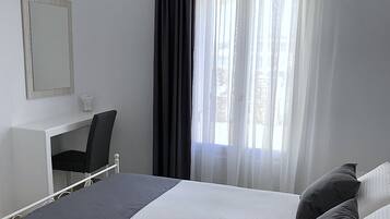 Apartment, 2 Bedrooms | In-room safe, soundproofing, iron/ironing board, free cribs/infant beds