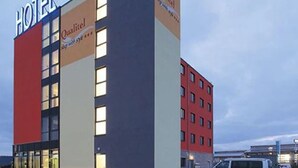 A hotel building with a prominent 'HOTEL' sign, multiple windows, and a 'Quality' sign on the facade. - Qualitel Hotel Hilpoltstein (Hilpoltstein)