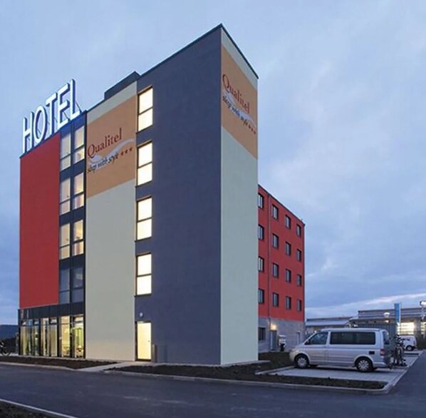 A hotel building with a prominent 'HOTEL' sign, multiple windows, and a 'Quality' sign on the facade. - Qualitel Hotel Hilpoltstein (Hilpoltstein)