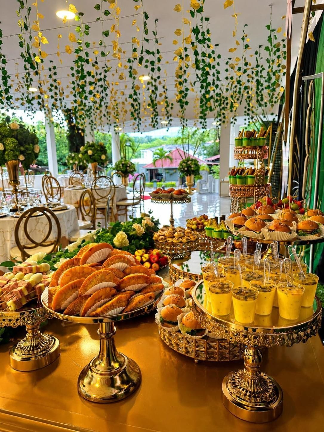 A buffet table with various food items and decorative elements.