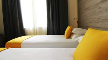 Luxe beddengoed, een minibar, een kluis op de kamer, een bureau