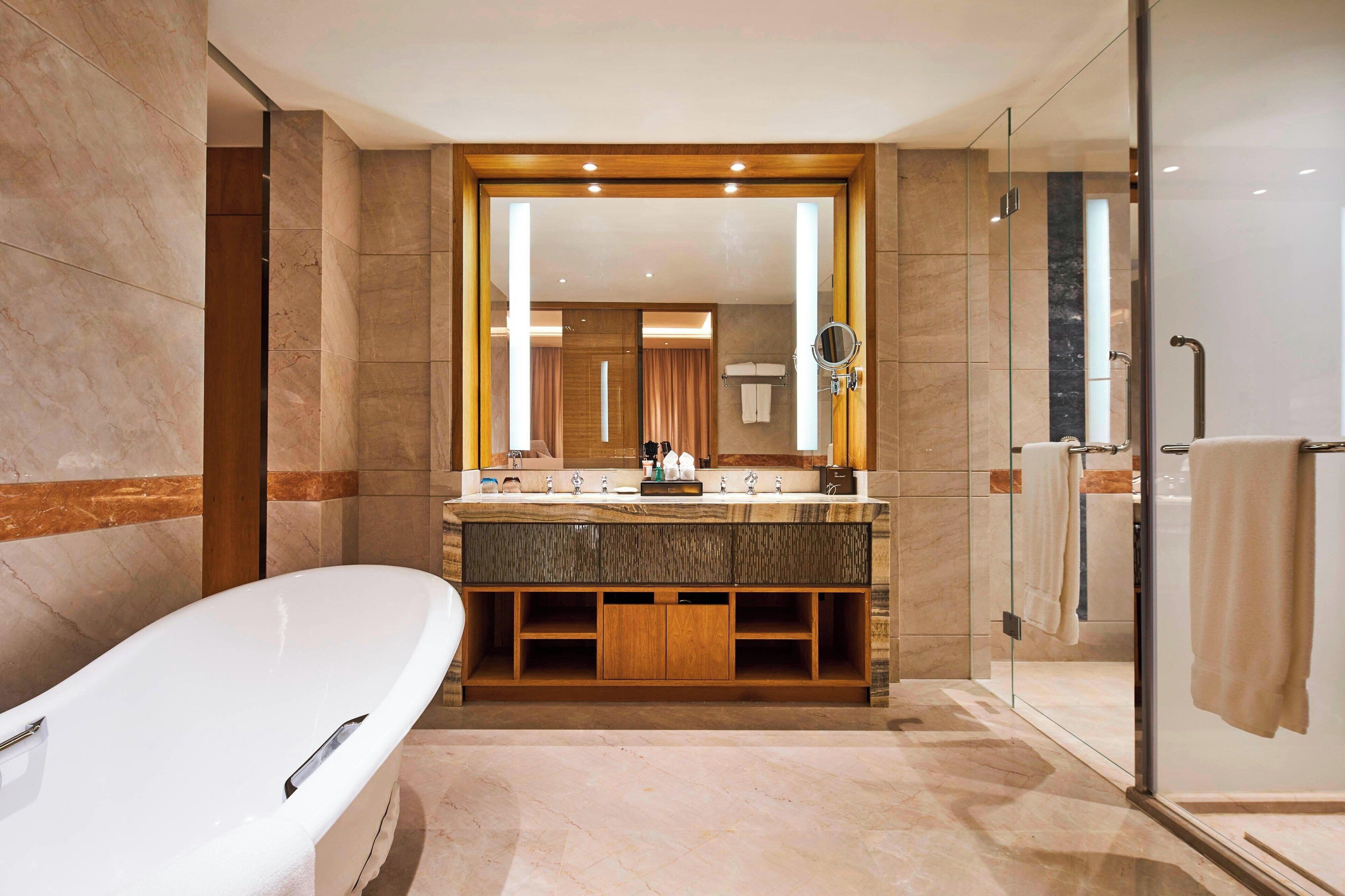 Separate tub and shower, rainfall showerhead, free toiletries