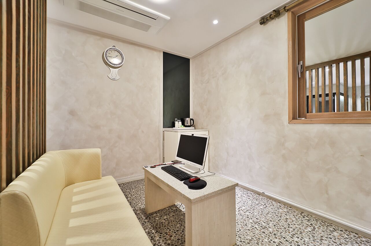 premium suite | premium bedding, desk, laptop workspace, blackout curtains