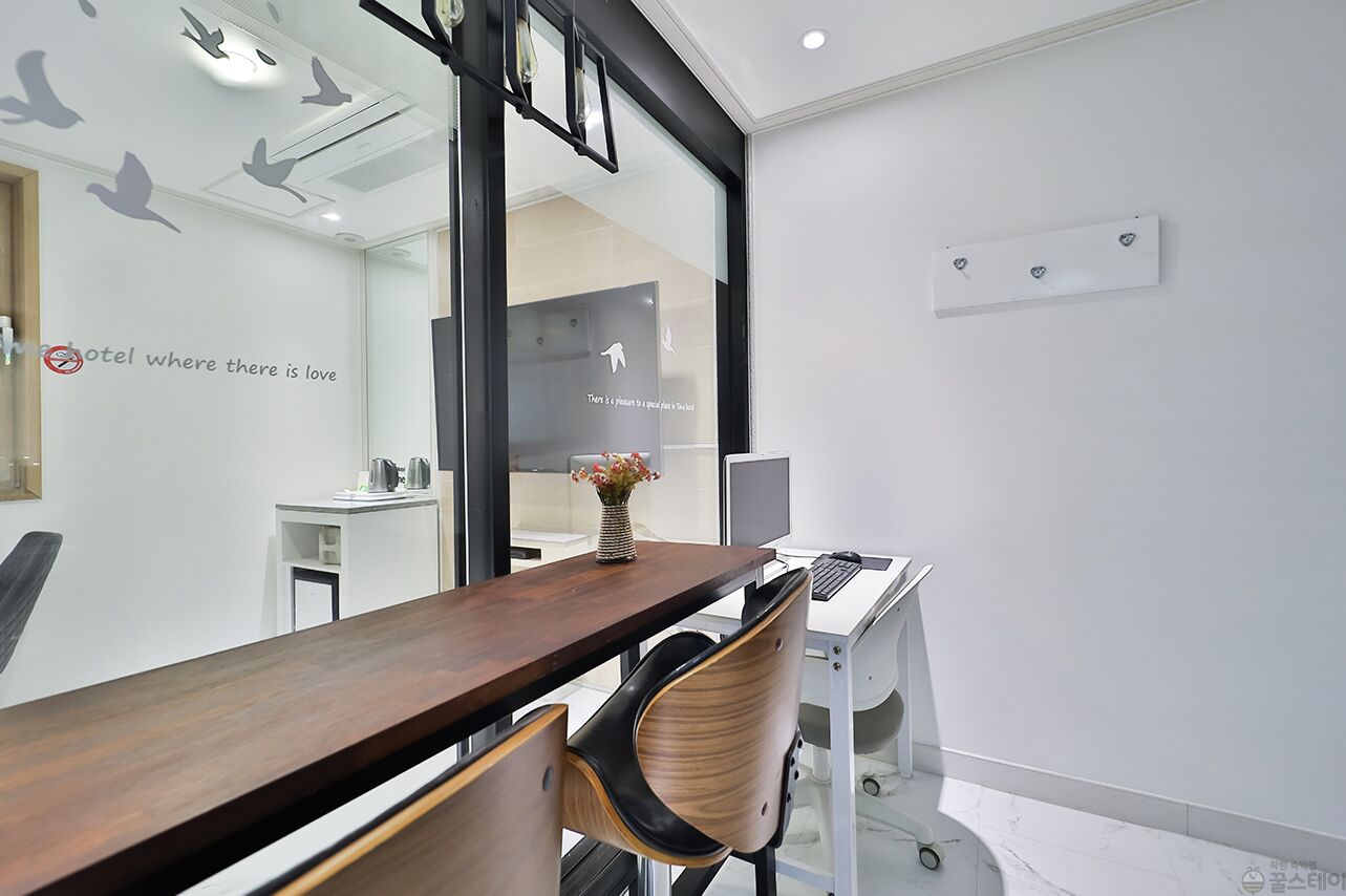 premium bedding, desk, laptop workspace, blackout curtains