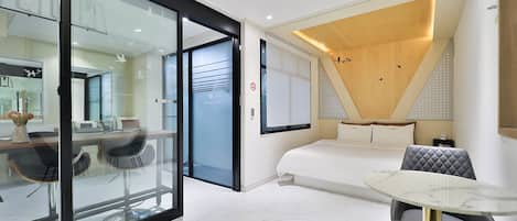 Premium bedding, desk, laptop workspace, blackout drapes