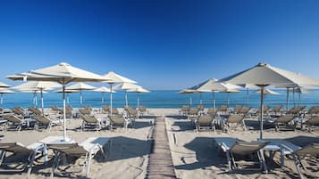 On the beach, sun loungers