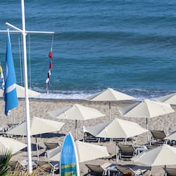 On the beach, sun-loungers