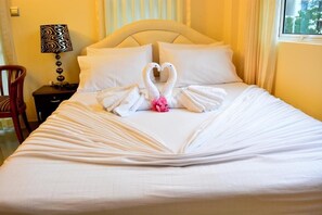 Premium bedding, down duvets, pillow-top beds, minibar