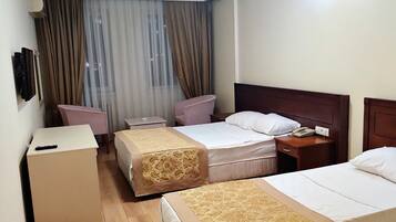 Standard Double or Twin Room | Minibar, in-room safe, laptop workspace, blackout curtains