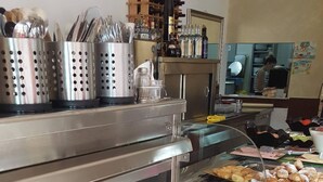 A buffet with various food items, including fruits, pastries, and a dessert station. - Greek Pride Ηotel and Apartments (Kassandra)