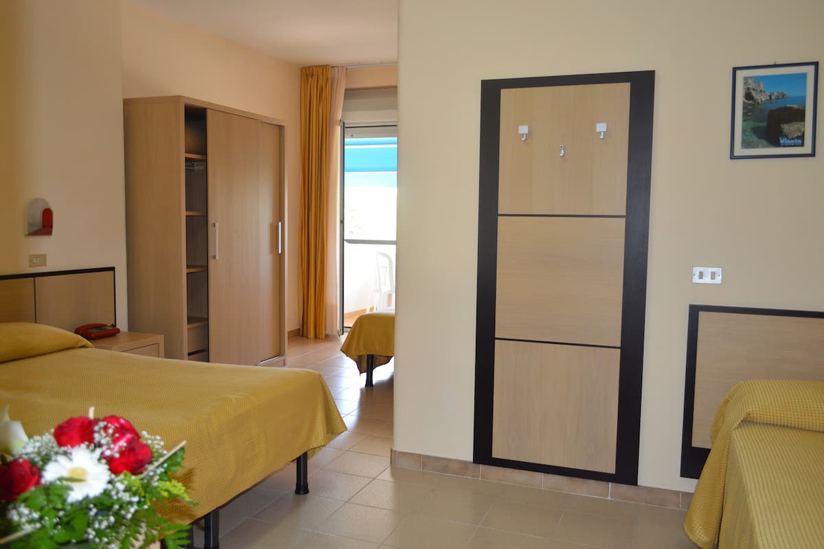 Quadruple Room, Sea View | Minibar, in-room safe, desk, soundproofing