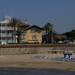 On the beach, sun-loungers, beach umbrellas, beach towels