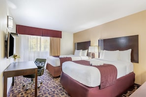 A hotel room with two beds, a desk, a chair, and a TV. - Days Inn by Wyndham Sylvan Lake (Sylvan Lake)