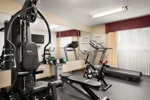 A gym with cardio equipment, weight machines, and a treadmill. - Days Inn by Wyndham Sylvan Lake (Sylvan Lake)
