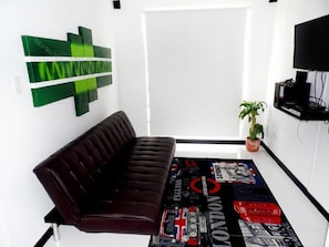 Family Apartment, 2 Bedrooms | Living room | 32-cm flat-screen TV with cable channels, TV - Apartasuites San Marcos (Cali)