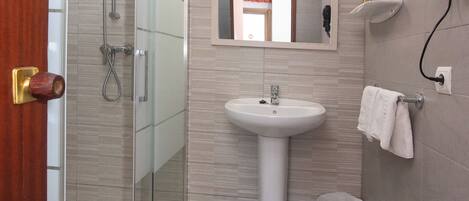 Shower, free toiletries, hair dryer, towels