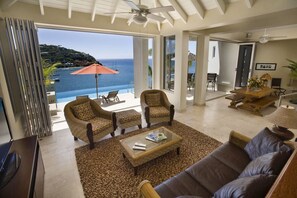 Luxury Villa, 6 Bedrooms | Living area | Flat-screen TV, DVD player, iPod dock, computer - VI Friendship Villa (St. John)