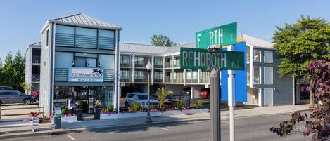 A motel with a modern design, located at the intersection of F. RHOBOTH AVE and REHOBOTH AVE.
