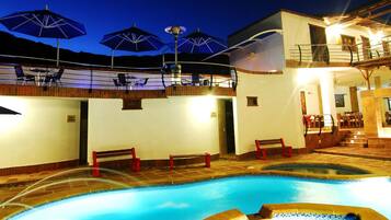 Indoor pool, outdoor pool, pool umbrellas, pool loungers