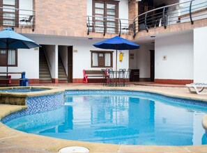 Indoor pool, outdoor pool, pool umbrellas, pool loungers