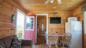 Standard Cottage, 2 Bedrooms | Living room | 50-inch Smart TV with digital channels