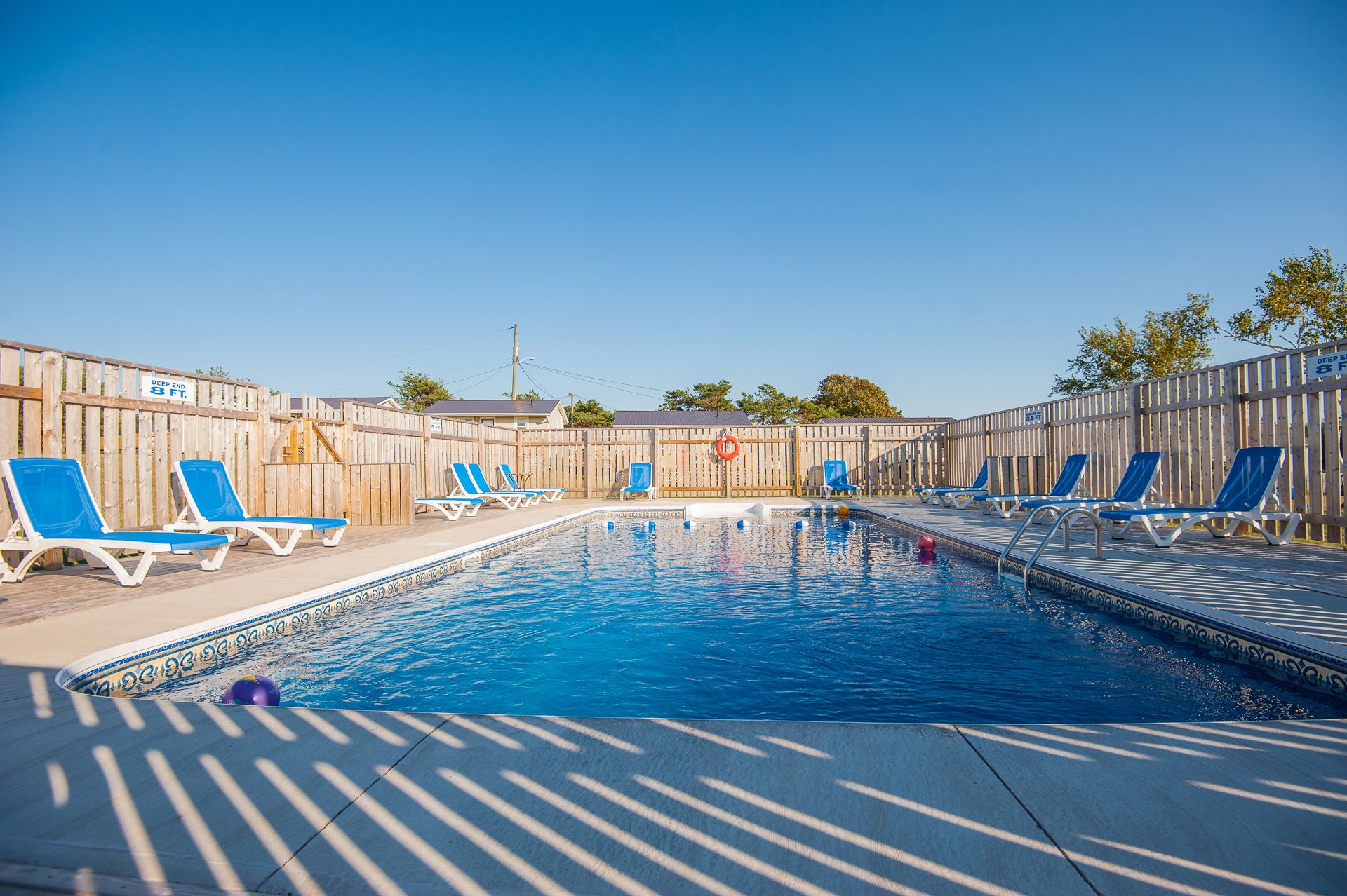 Seasonal outdoor pool, pool umbrellas, pool loungers