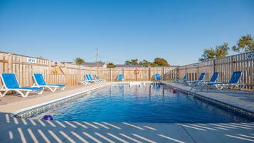 Seasonal outdoor pool, pool umbrellas, pool loungers