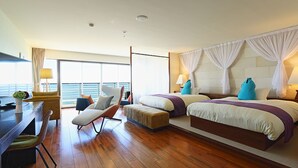 A modern hotel room with a large bed, two bedside tables, a desk, a chair, and a view of the ocean. - THE ONJUKU terrace (Onjuku)