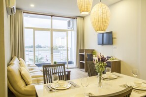 Luxury Apartment, 1 Bedroom, River View | Living area | 32-inch LCD TV with cable channels, TV, DVD player