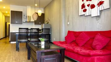 Luxury Apartment, 1 Bedroom, River View | Living area | 32-inch LCD TV with cable channels, TV, DVD player
