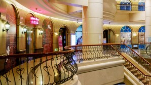 A spacious lobby with a grand staircase, arched ceilings, and a prominent sign for 'Angel Hotel'. - Angels' Hostel - Taipei Ximen (Taipei)