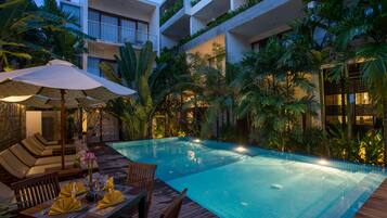 Outdoor pool, open 6:00 AM to 9:00 PM, pool umbrellas, pool loungers